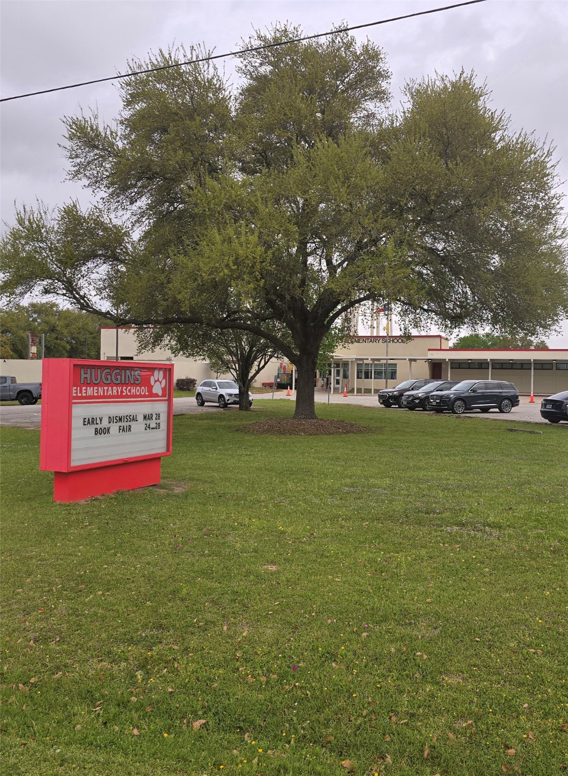 7514 Dixon Road Fulshear, TX 77441 - Photo 6 of 13 a sign that is sitting in the grass next to a road