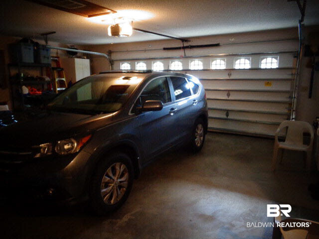 2804 Pine Ridge Drive Lillian, AL 36549 - Photo 17 of 39 Attached 2.5 car garage. New insulated overhead door and electric door opener,2015. Pull down stairs to large attic area for storage.