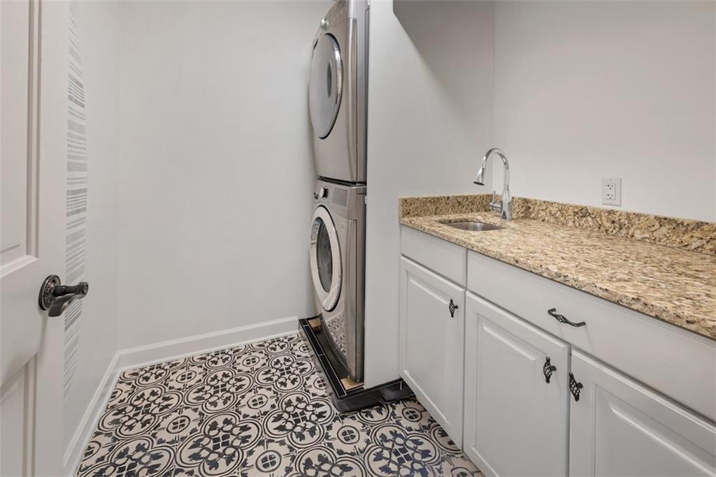 317 Blue Run Road Cheswick, PA 15024 - Photo 19 of 50 Convenient first floor laundry with attractive tile floor, sink and loads of storage.