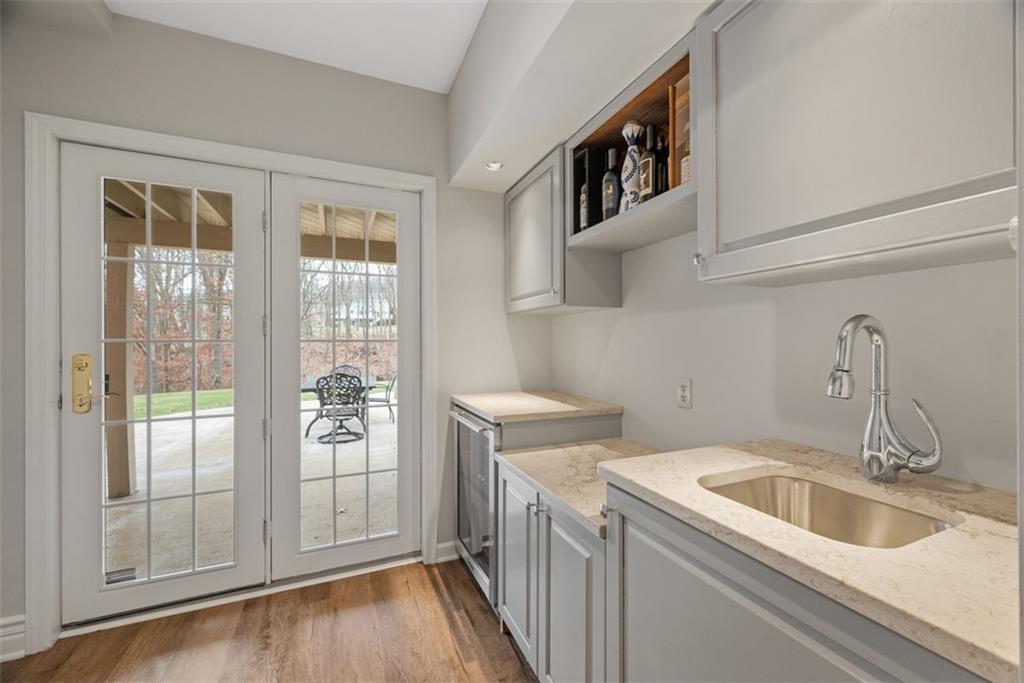 317 Blue Run Road Cheswick, PA 15024 - Photo 41 of 50 Wet bar with custom counter top, sink, fixtures and wine/beverage fridge.