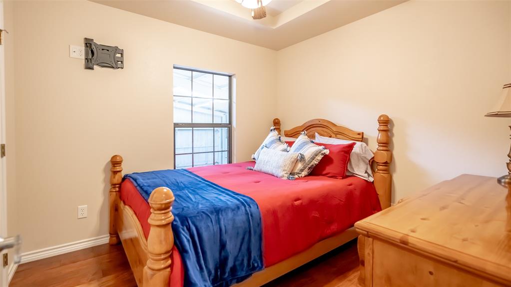 659 Aviator Drive Fort Worth, TX 76179 - Photo 18 of 40 a bedroom with a bed and a window