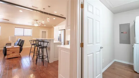 a utility room with cabinets washer and dryer