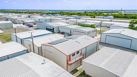 an aerial view of a house with a big yard