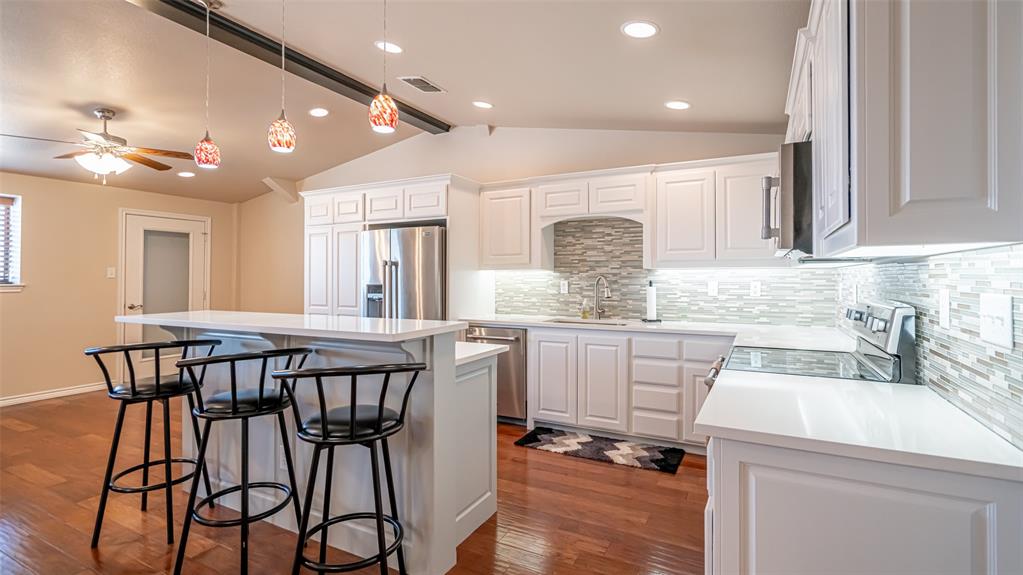 659 Aviator Drive Fort Worth, TX 76179 - Photo 25 of 40 an open kitchen with a table and chairs in it