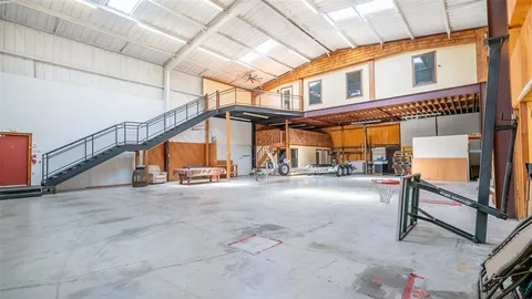 a view of an empty room with stairs