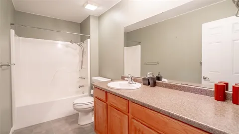 a kitchen with stainless steel appliances a stove a refrigerator and cabinets