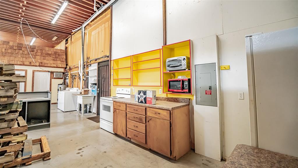 659 Aviator Drive Fort Worth, TX 76179 - Photo 35 of 40 a kitchen with stainless steel appliances a stove a refrigerator and cabinets