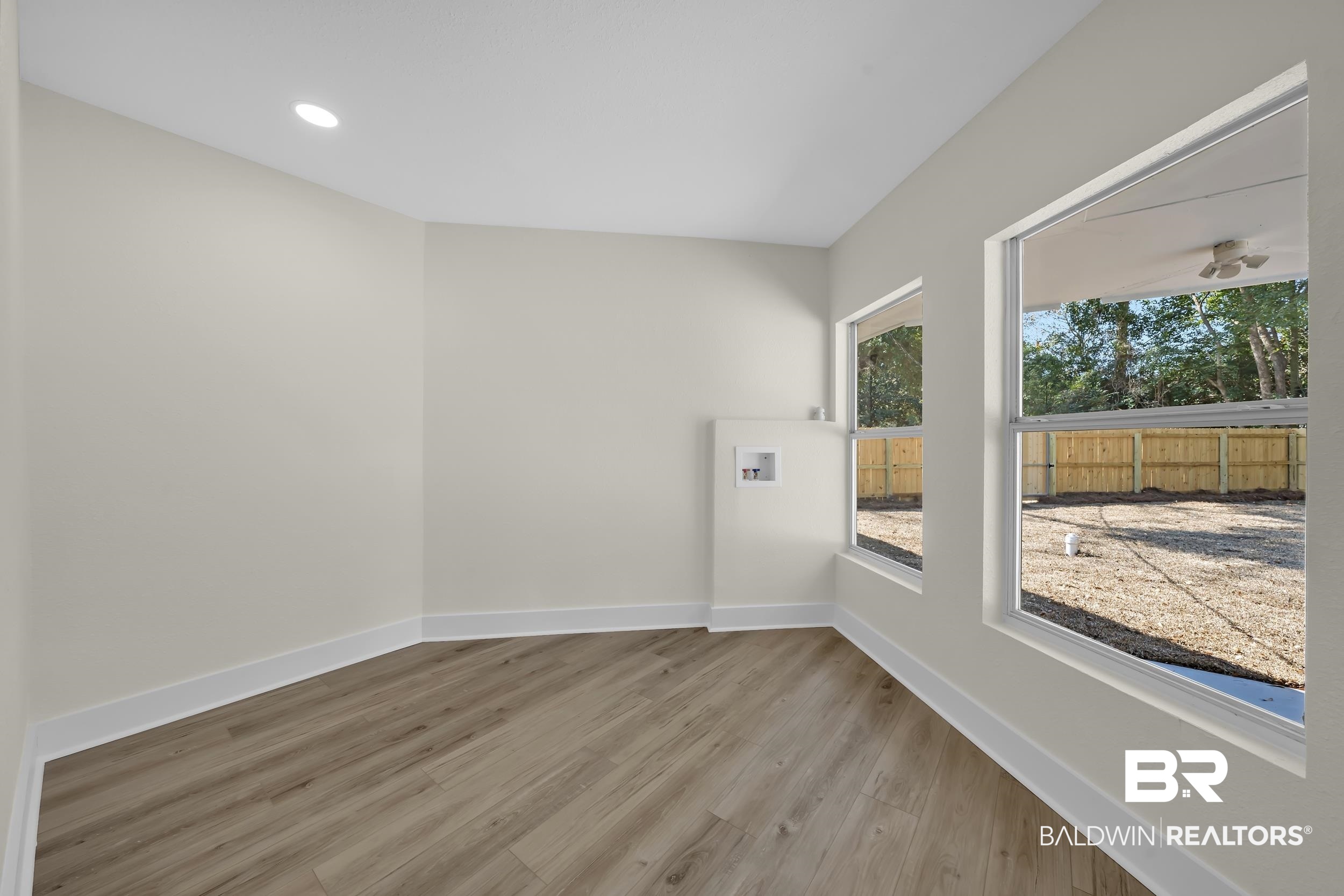 1409 Altair Lane Mobile, AL 36693 - Photo 18 of 23 Empty room with light wood-style floors and recessed lighting