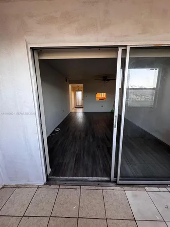 a kitchen with granite countertop stainless steel appliances a stove a sink cabinets and a window