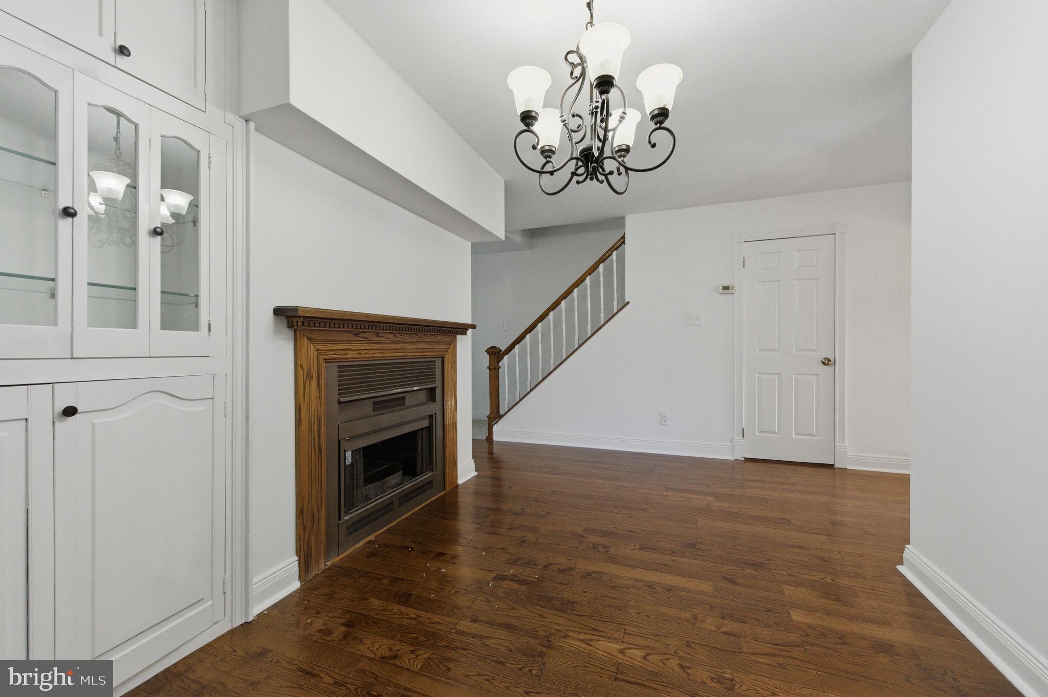 3305 Keswick Way, Unit 3305D Newtown Square, PA 19073 - Photo 12 of 38 a view of a livingroom with a chandelier wooden floor and chandelier