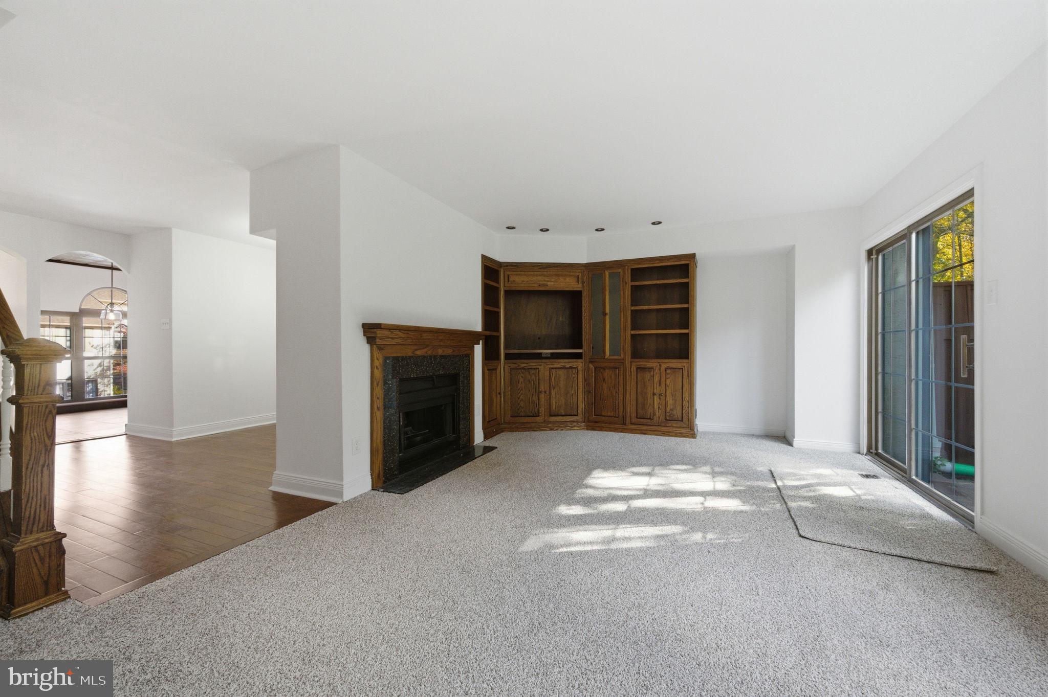 3305 Keswick Way, Unit 3305D Newtown Square, PA 19073 - Photo 14 of 38 a view of an empty room with a fireplace and a window