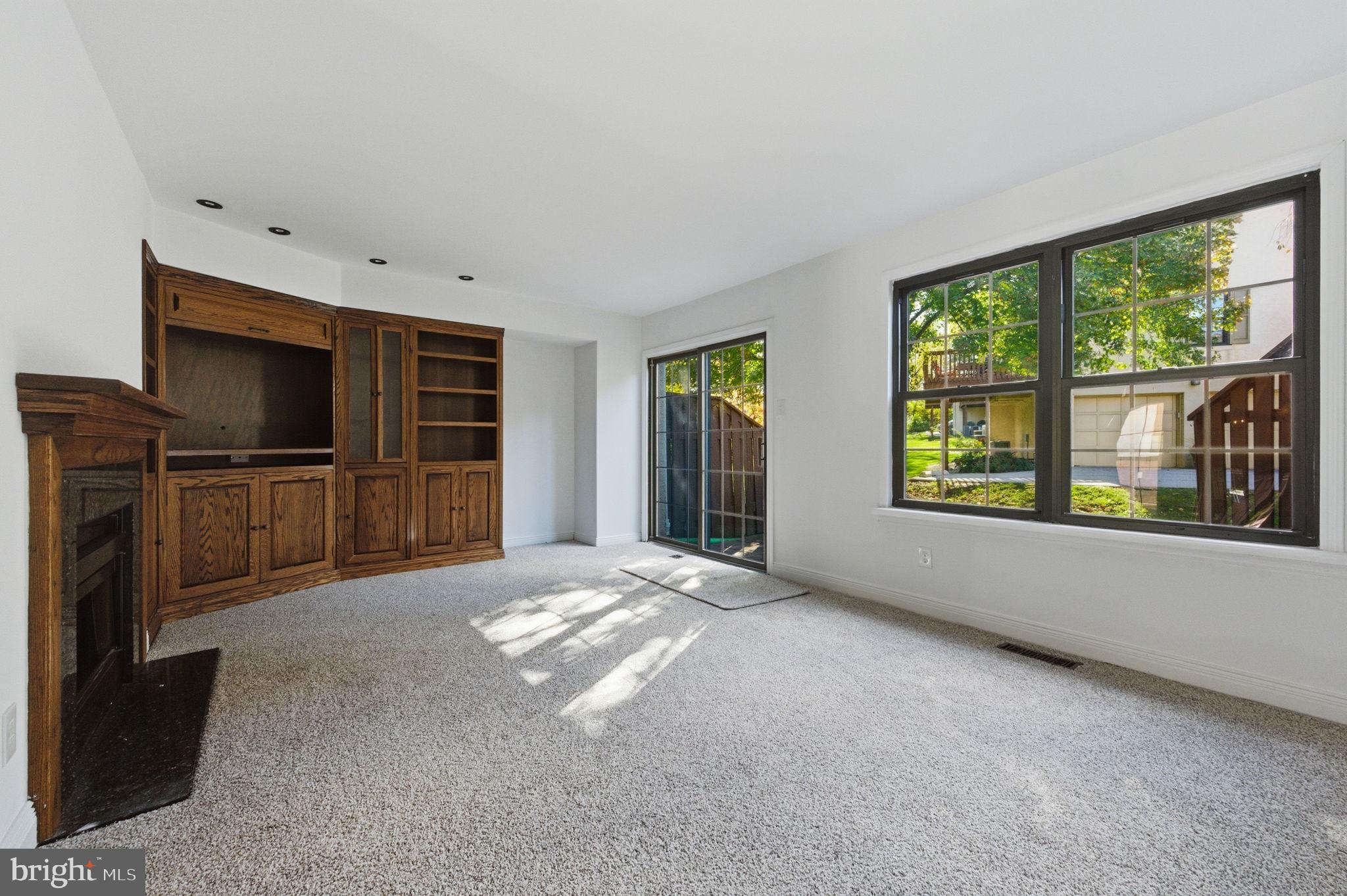 3305 Keswick Way, Unit 3305D Newtown Square, PA 19073 - Photo 15 of 38 a view of an empty room with a window and a kitchen
