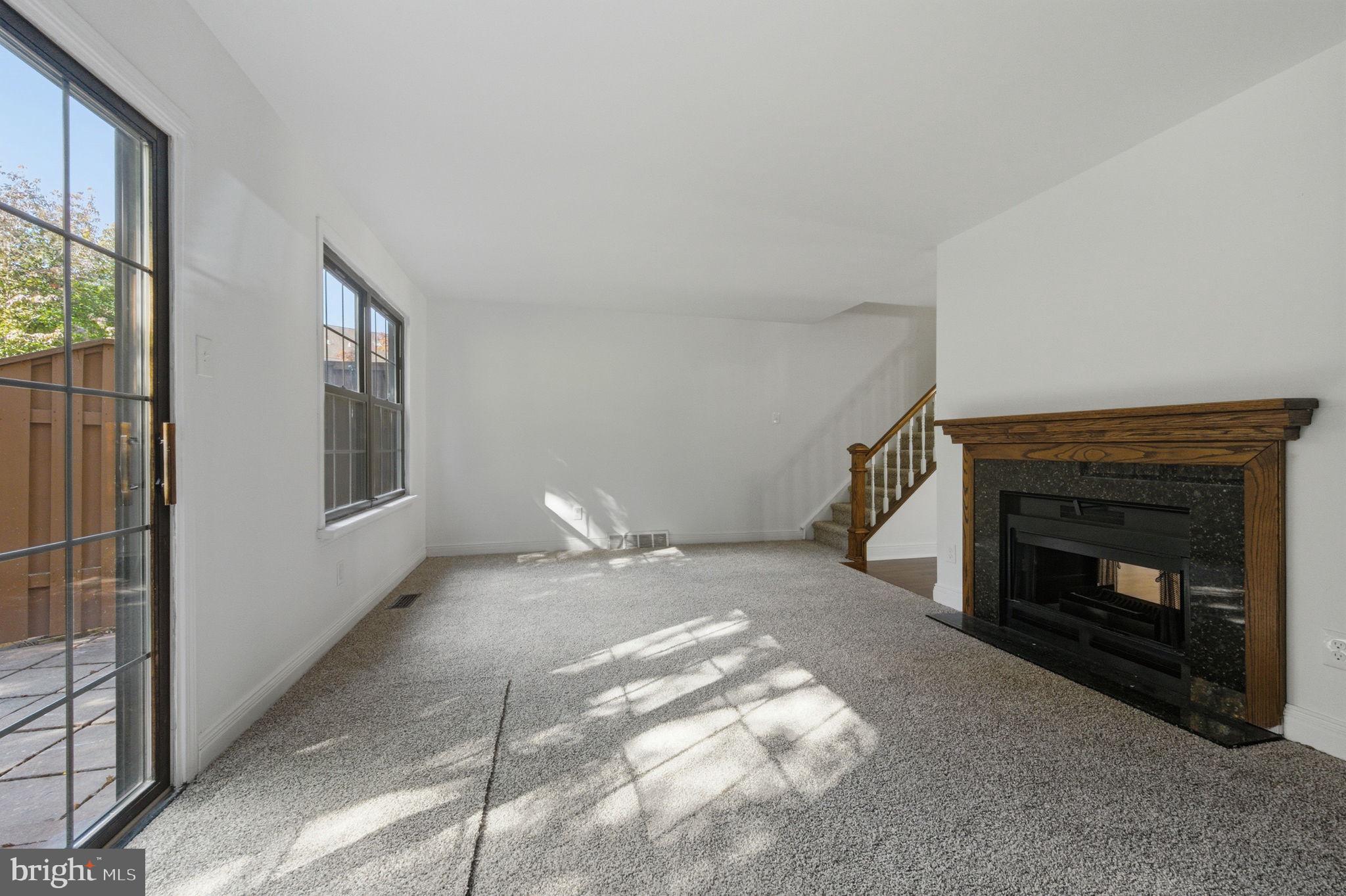 3305 Keswick Way, Unit 3305D Newtown Square, PA 19073 - Photo 16 of 38 a view of empty room with fireplace and fan