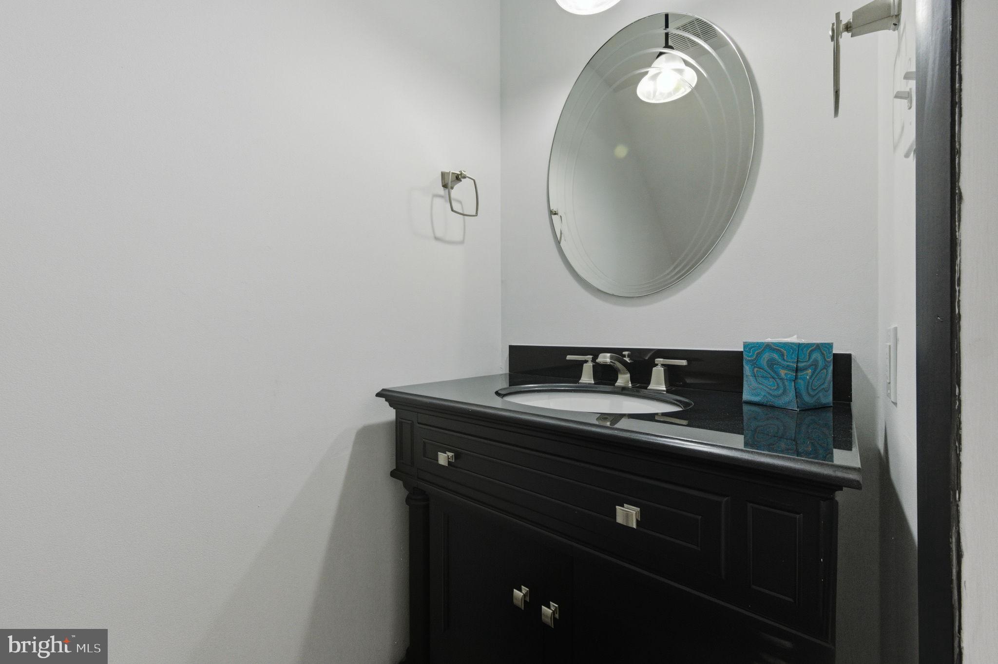 3305 Keswick Way, Unit 3305D Newtown Square, PA 19073 - Photo 17 of 38 a bathroom with a sink and a mirror