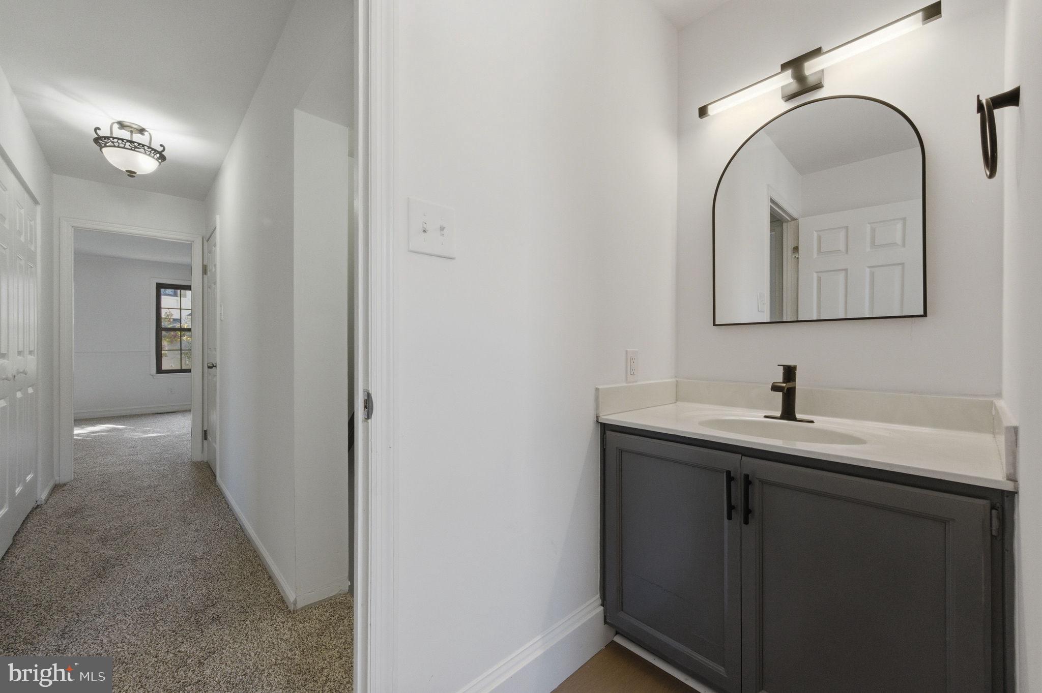 3305 Keswick Way, Unit 3305D Newtown Square, PA 19073 - Photo 25 of 38 a bathroom with a sink and a mirror