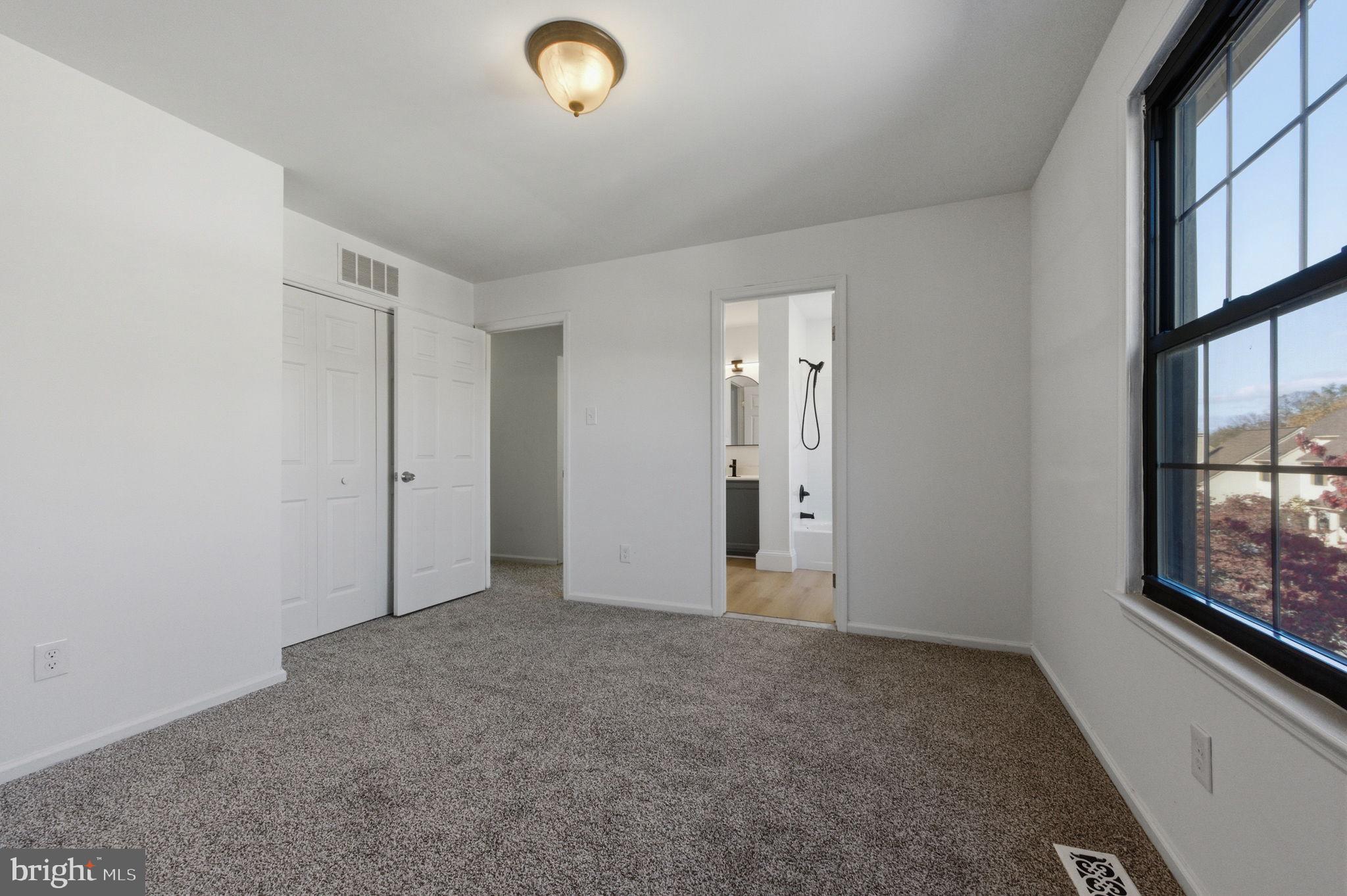 3305 Keswick Way, Unit 3305D Newtown Square, PA 19073 - Photo 27 of 38 an empty room with windows