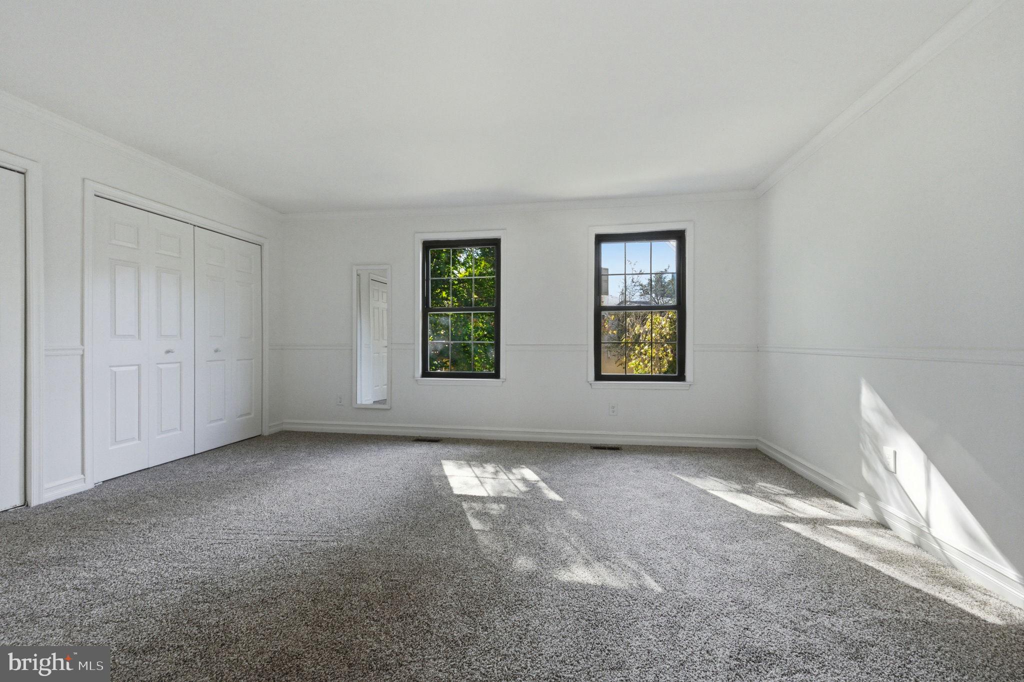 3305 Keswick Way, Unit 3305D Newtown Square, PA 19073 - Photo 29 of 38 an empty room with windows