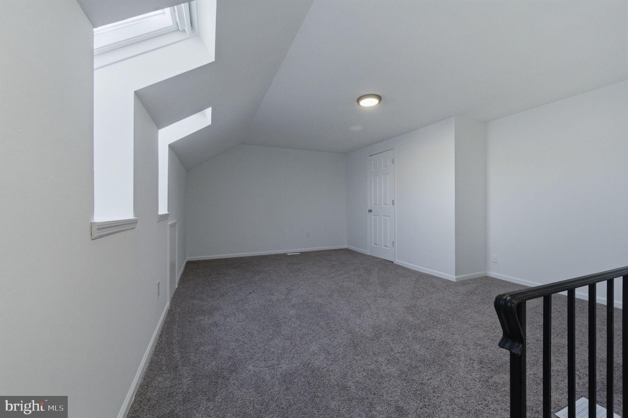 3305 Keswick Way, Unit 3305D Newtown Square, PA 19073 - Photo 35 of 38 a view of a big room with wooden floor and windows