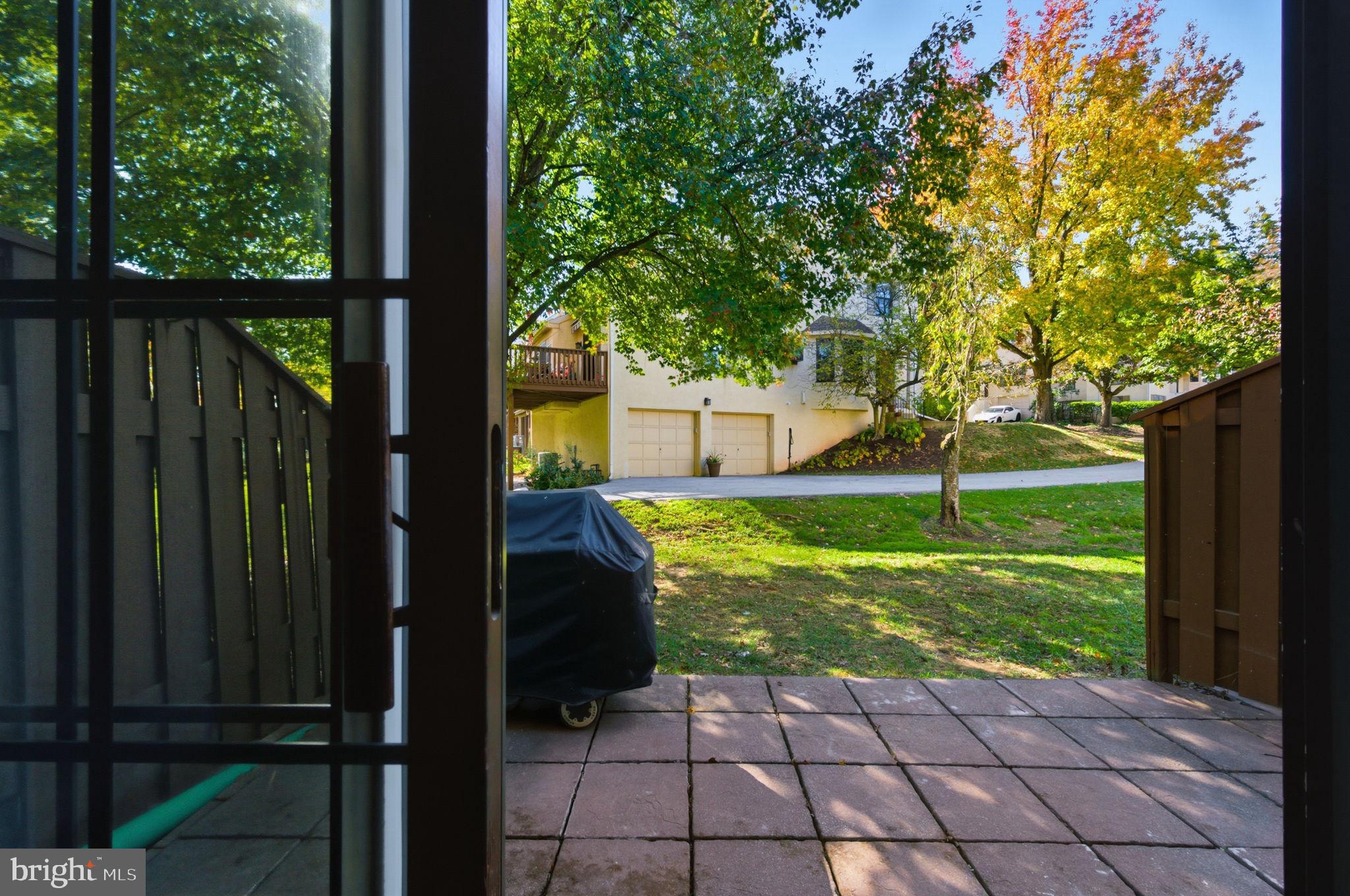 3305 Keswick Way, Unit 3305D Newtown Square, PA 19073 - Photo 5 of 38 a view of a backyard with garden