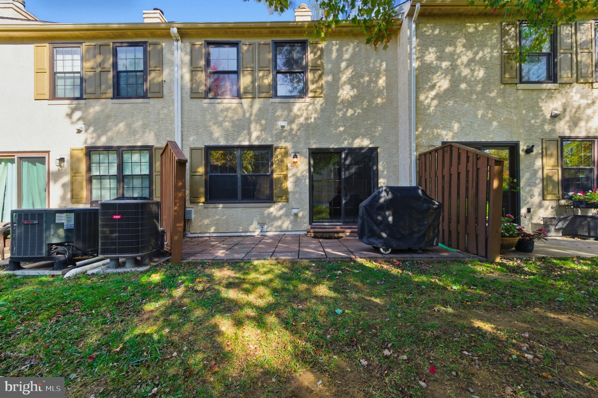 3305 Keswick Way, Unit 3305D Newtown Square, PA 19073 - Photo 7 of 38 a view of a house with a yard and sitting area
