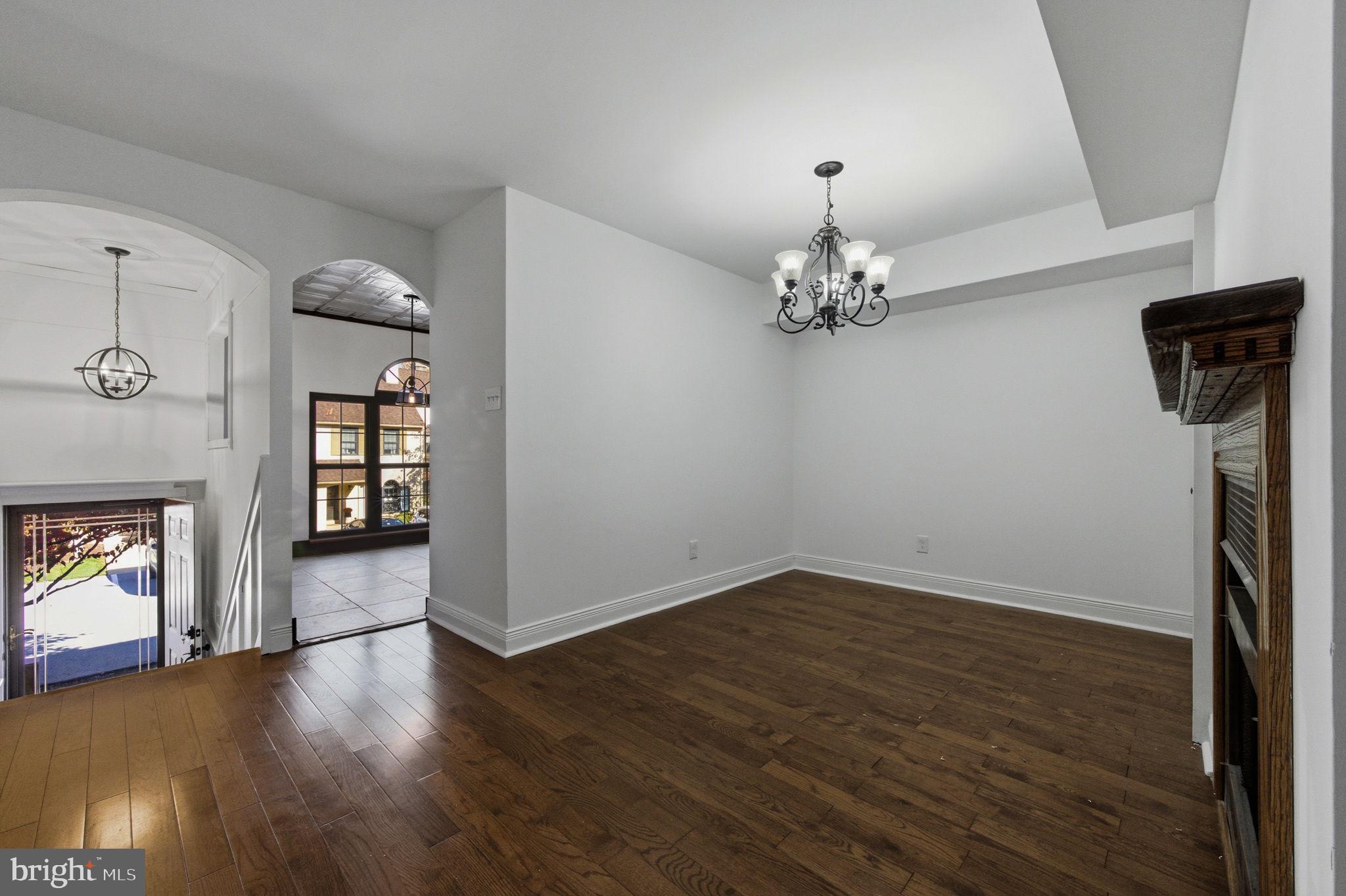 3305 Keswick Way, Unit 3305D Newtown Square, PA 19073 - Photo 10 of 38 wooden floor in an empty room with a window