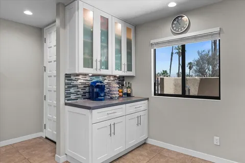 a kitchen with stainless steel appliances granite countertop a stove and a refrigerator