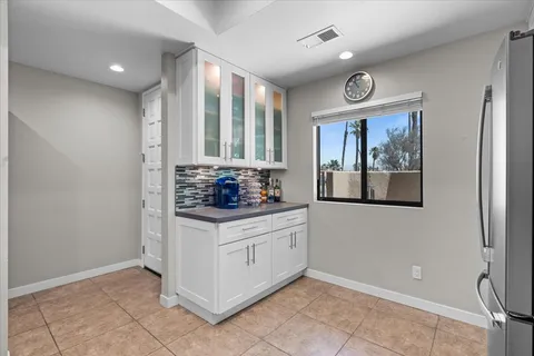 a spacious bedroom with a bed and a desk