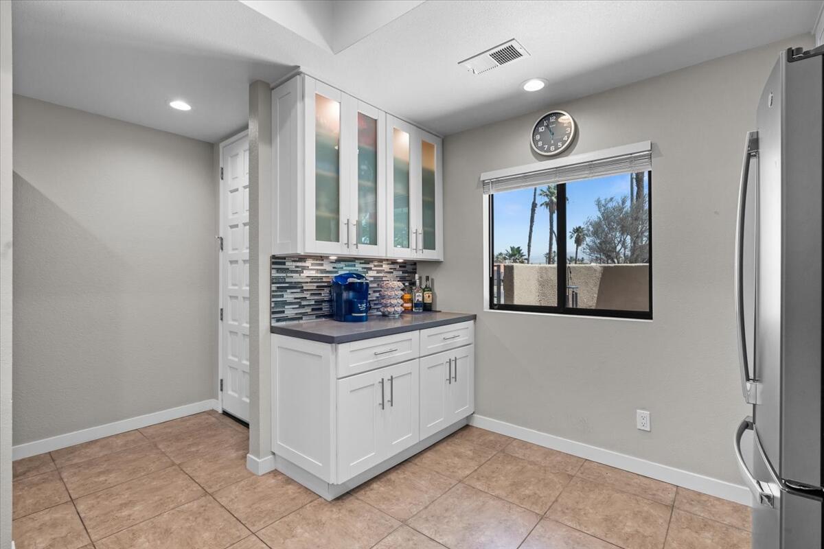 67527 North Portales Drive Cathedral City, CA 92234 - Photo 14 of 47 a kitchen with stainless steel appliances granite countertop a stove and a refrigerator