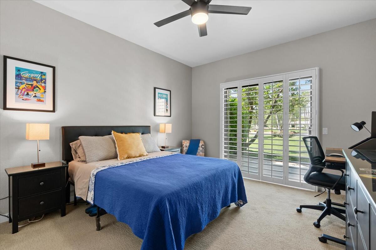 67527 North Portales Drive Cathedral City, CA 92234 - Photo 15 of 47 a spacious bedroom with a bed and a desk