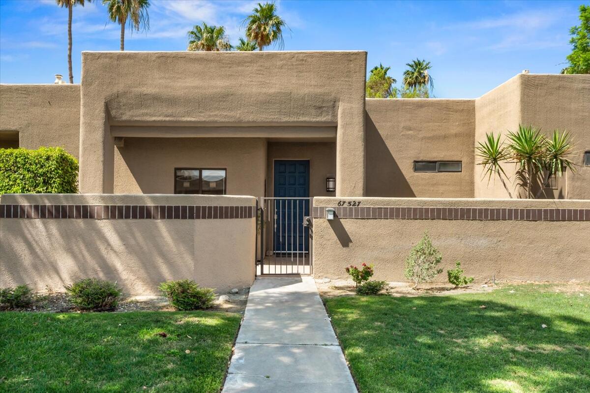 67527 North Portales Drive Cathedral City, CA 92234 - Photo 3 of 47 a front view of a house with garden
