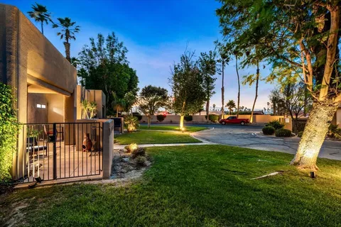 a living room with furniture large window and flat screen tv