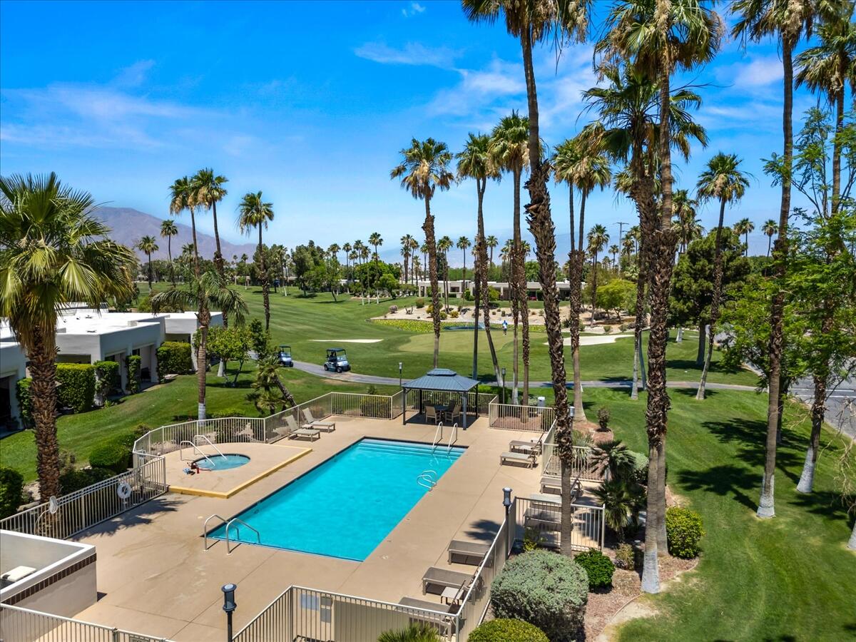 67527 North Portales Drive Cathedral City, CA 92234 - Photo 39 of 47 a view of a swimming pool and lounge chairs in back yard of the house