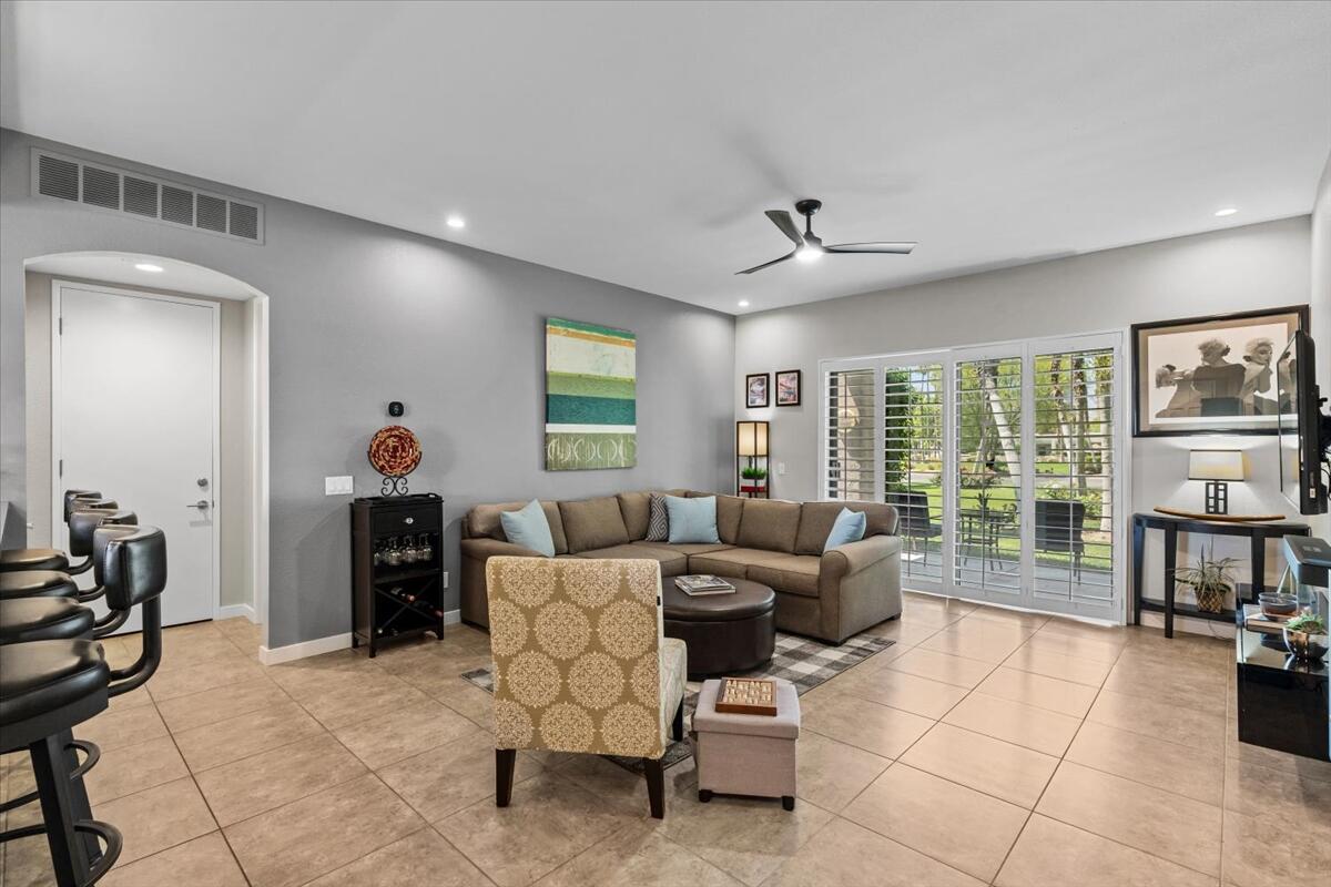 67527 North Portales Drive Cathedral City, CA 92234 - Photo 6 of 47 a living room with furniture a flat screen tv and a table