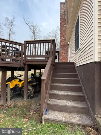 a kitchen with kitchen island granite countertop a sink table and chairs