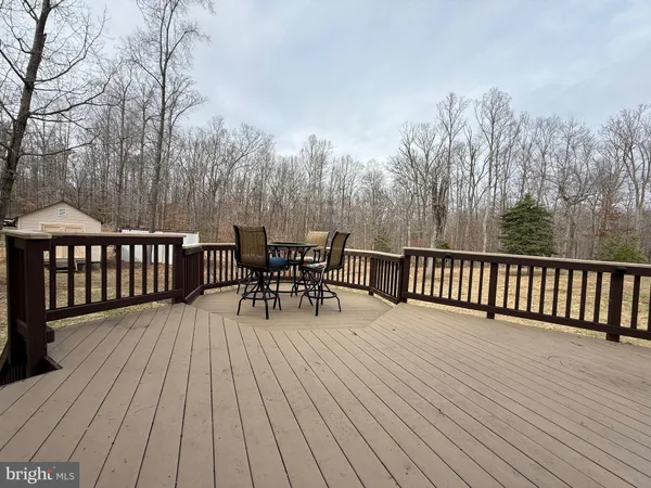 a room with a bed and a chandelier