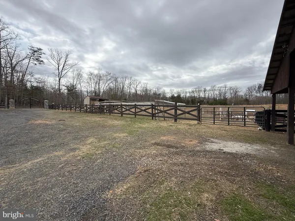a view of a room with wooden floor and windows