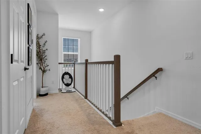 a view of a bathroom with a sink and washing machine