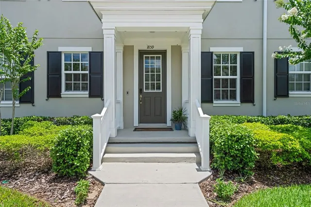 front view of the house with potted plants