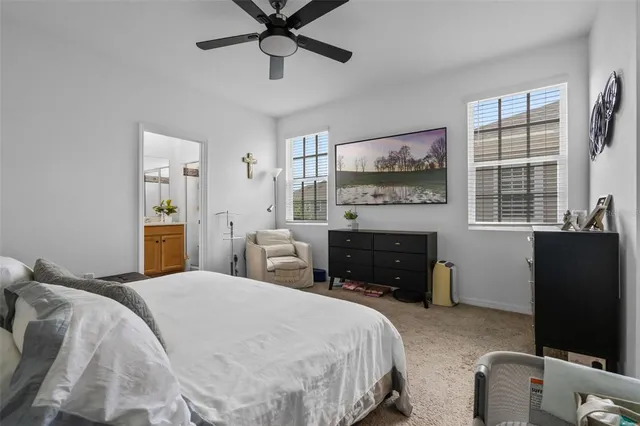 a bedroom with a bed and a television