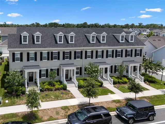 a view of multiple houses with a street