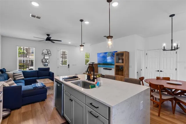 a kitchen with a dining table and chairs