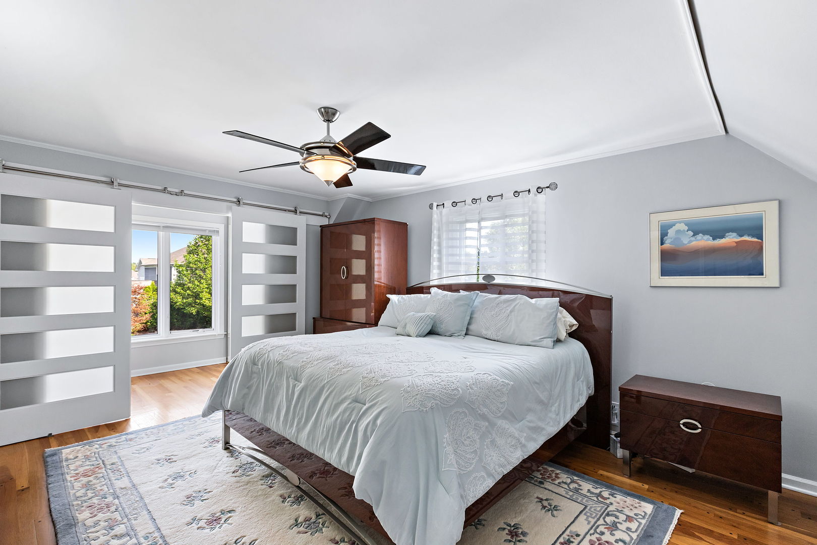 N543 Herrick Drive Wheaton, IL 60187 - Photo 13 of 29 a bedroom with a large bed and a window