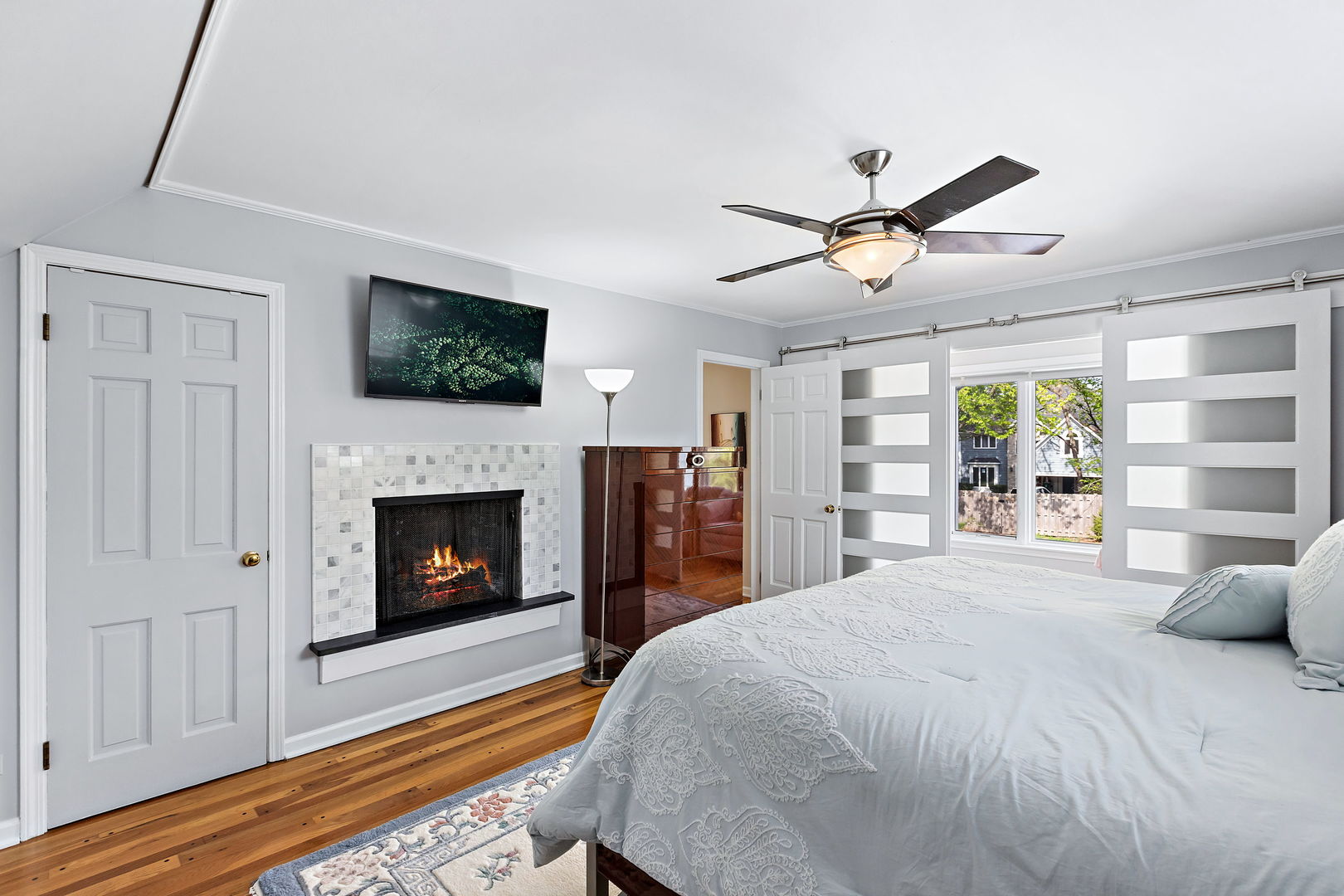 N543 Herrick Drive Wheaton, IL 60187 - Photo 14 of 29 a bedroom with a bed and a flat screen tv