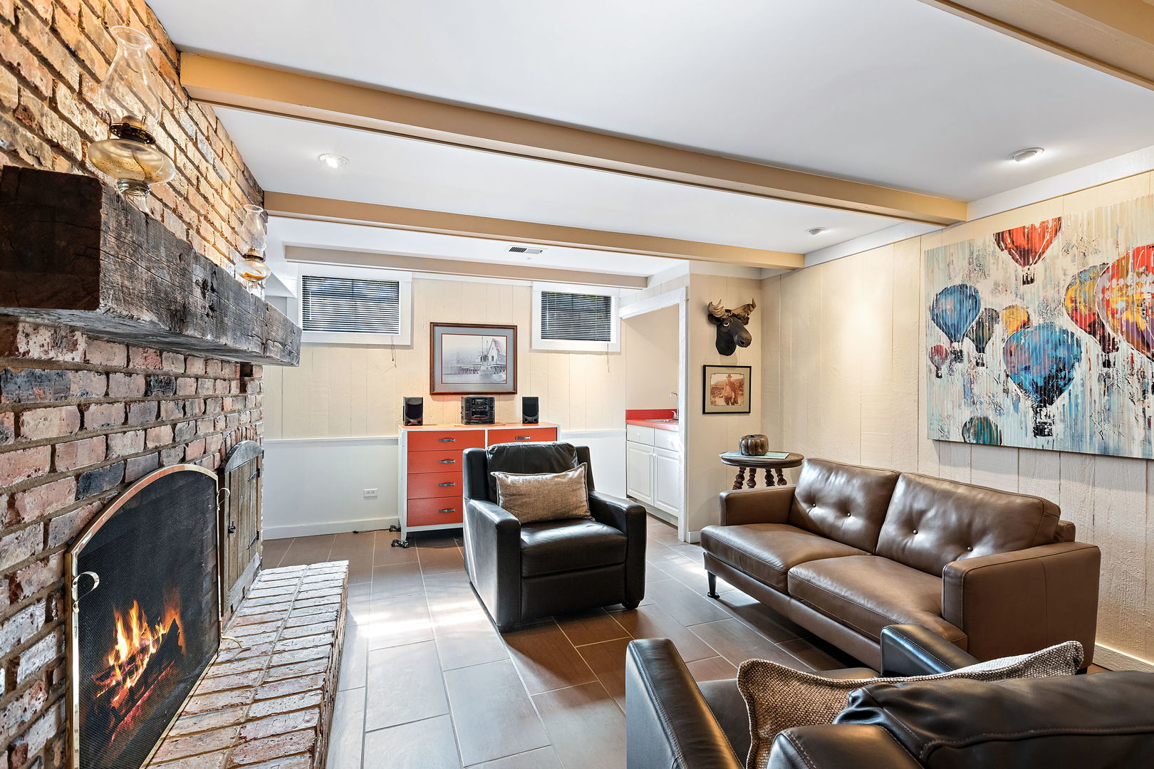 N543 Herrick Drive Wheaton, IL 60187 - Photo 19 of 29 a living room with furniture a flat screen tv and a fireplace