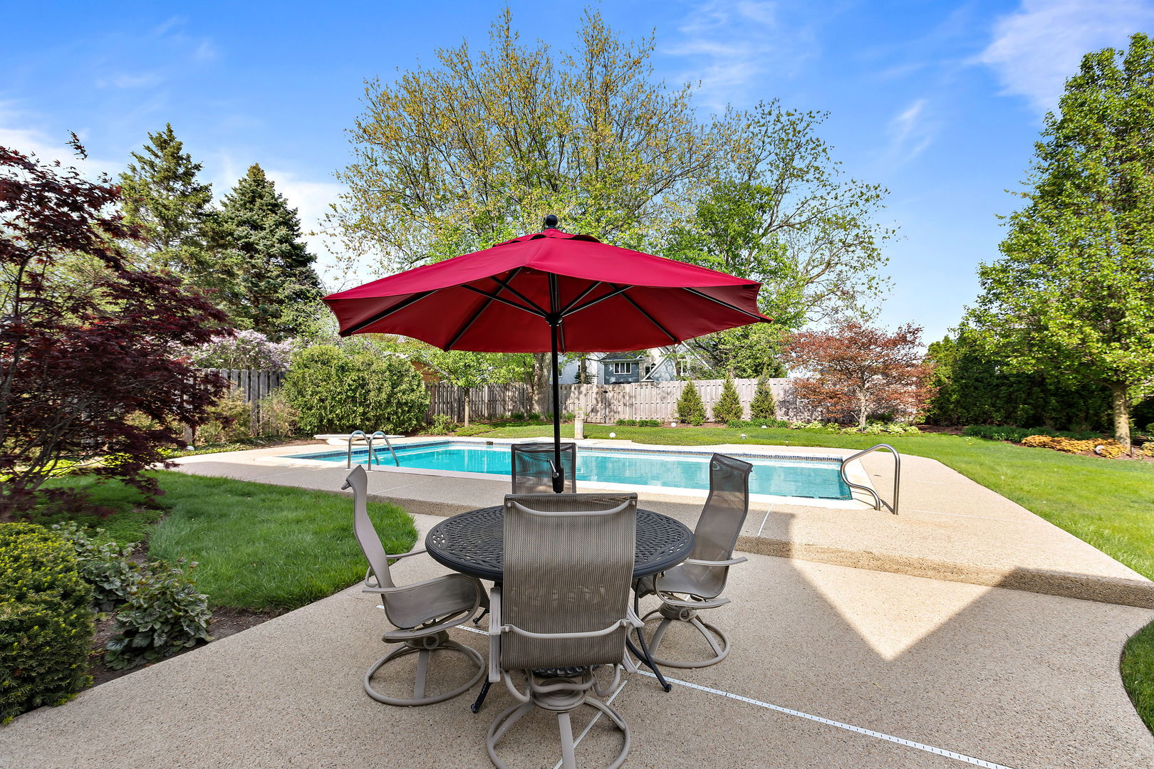 N543 Herrick Drive Wheaton, IL 60187 - Photo 25 of 29 a view of pool with table and chairs under an umbrella