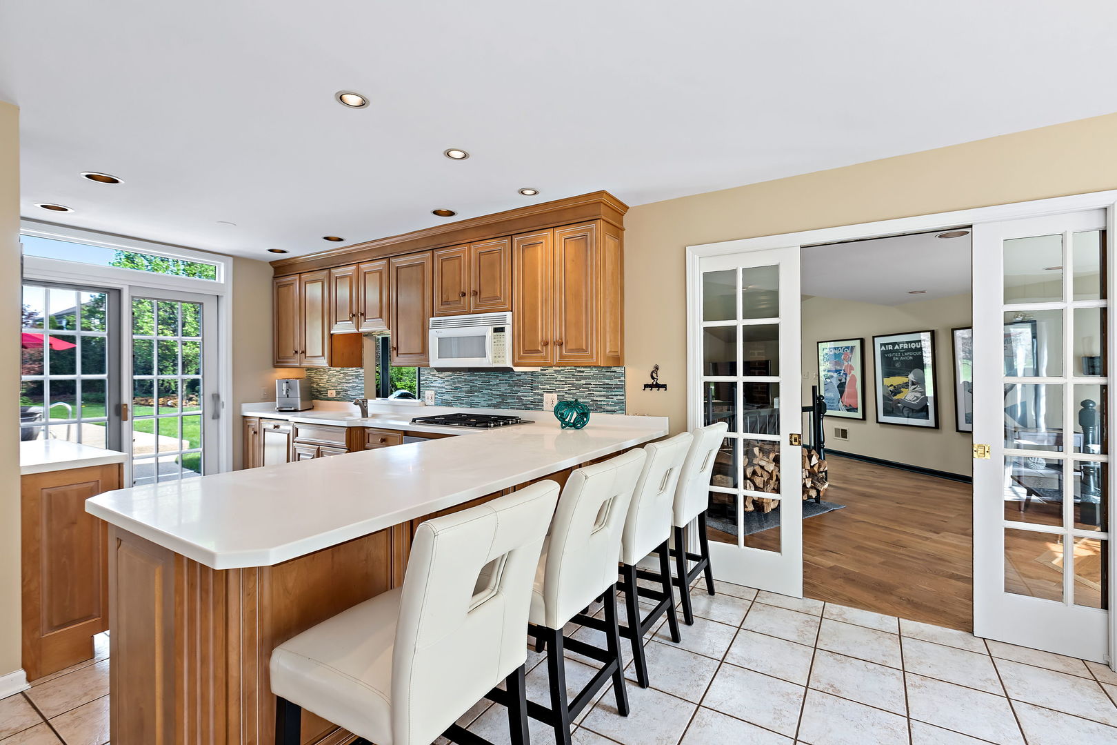 N543 Herrick Drive Wheaton, IL 60187 - Photo 6 of 29 a room with stainless steel appliances kitchen island granite countertop a table and chairs in it
