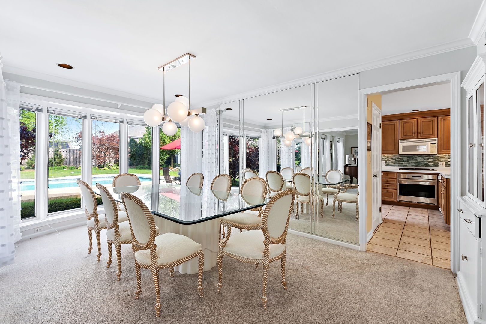 N543 Herrick Drive Wheaton, IL 60187 - Photo 10 of 29 a view of a dining room and livingroom with furniture wooden floor a chandelier