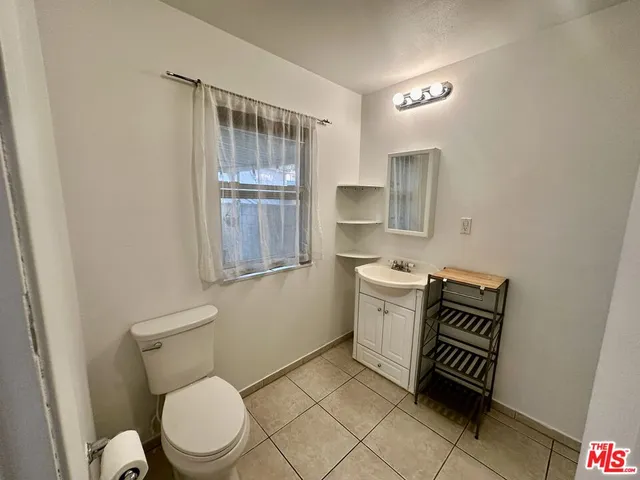 a bathroom with a toilet a sink and a bathtub