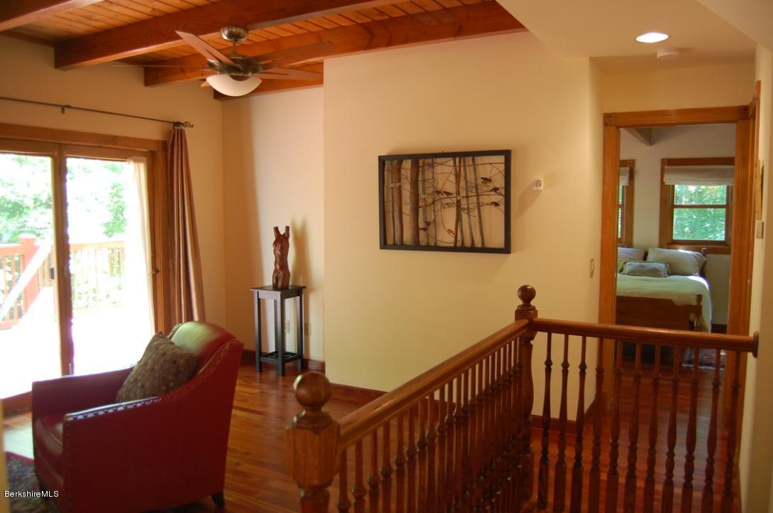 86 Leland Road Becket, MA 01223 - Photo 11 of 37 a view of a hallway with couches and a chandelier