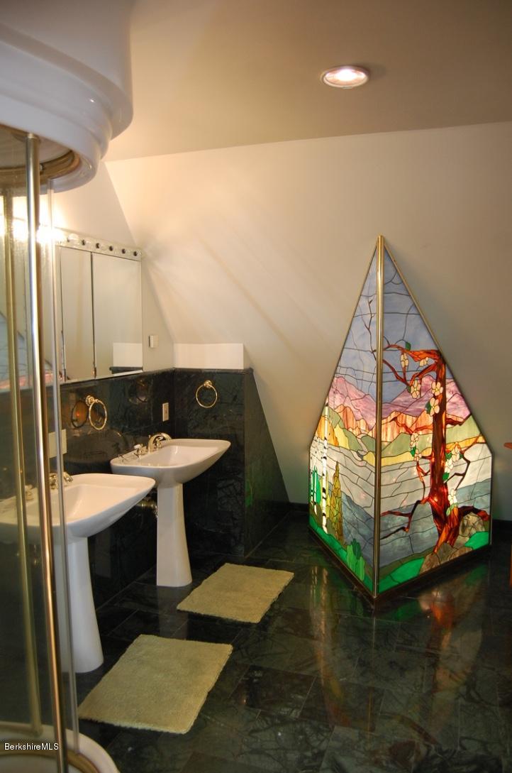 86 Leland Road Becket, MA 01223 - Photo 20 of 37 a bathroom with a sink and mirror with toilet